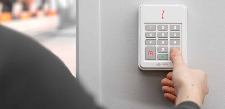 person using access control panel outside building