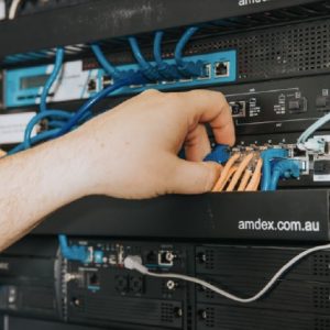 hand organising wires in the server
